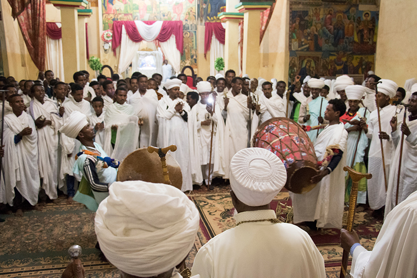Priests and deacons celebrating the Christmas eve mass during the Orthodox Tewahedo celebration of Gena in the church of St. Gabriel, Bahir Dar, Ethiopia