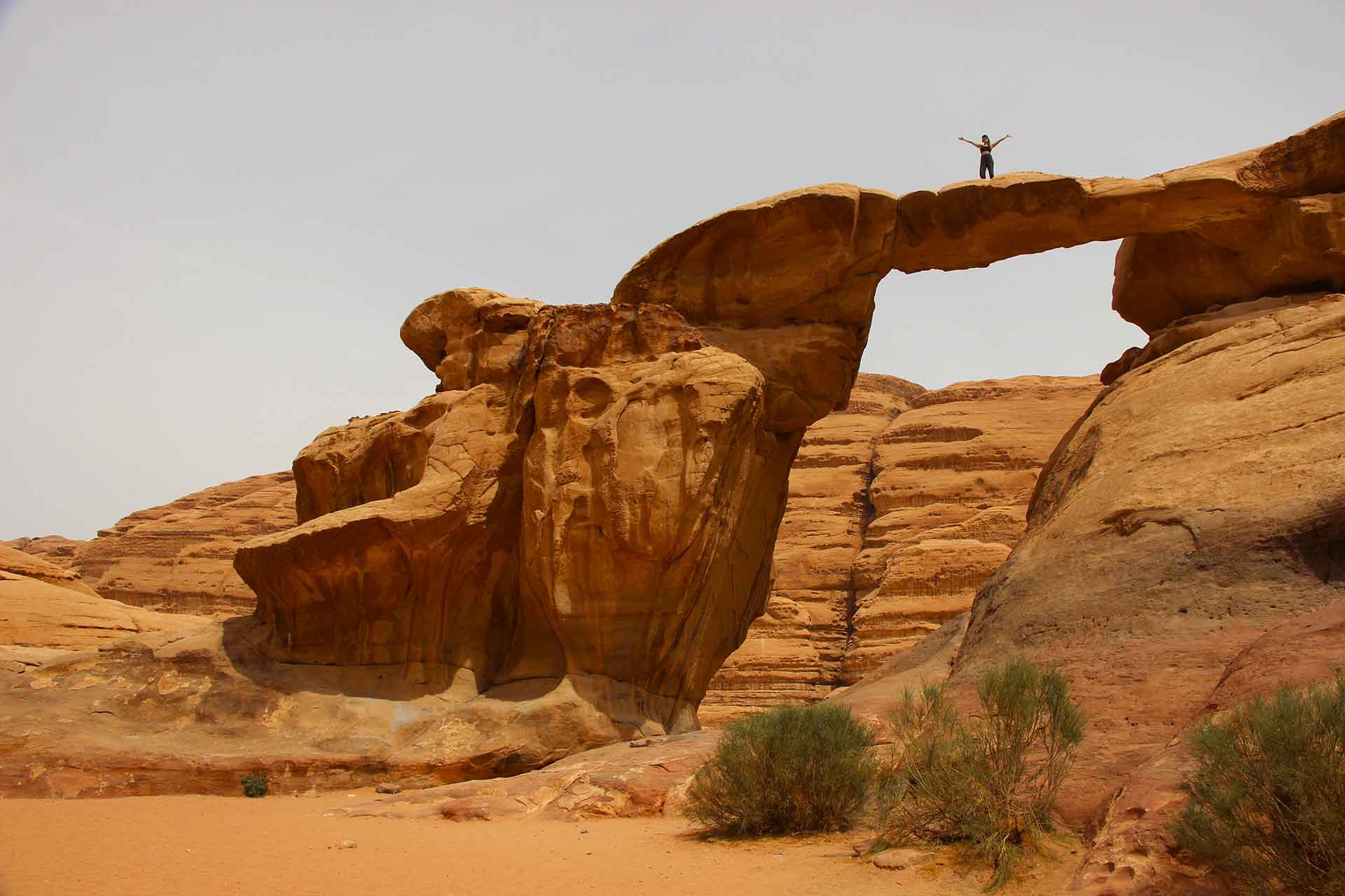 Climbing one of Wadi Rum’s many rock arches in Jordan