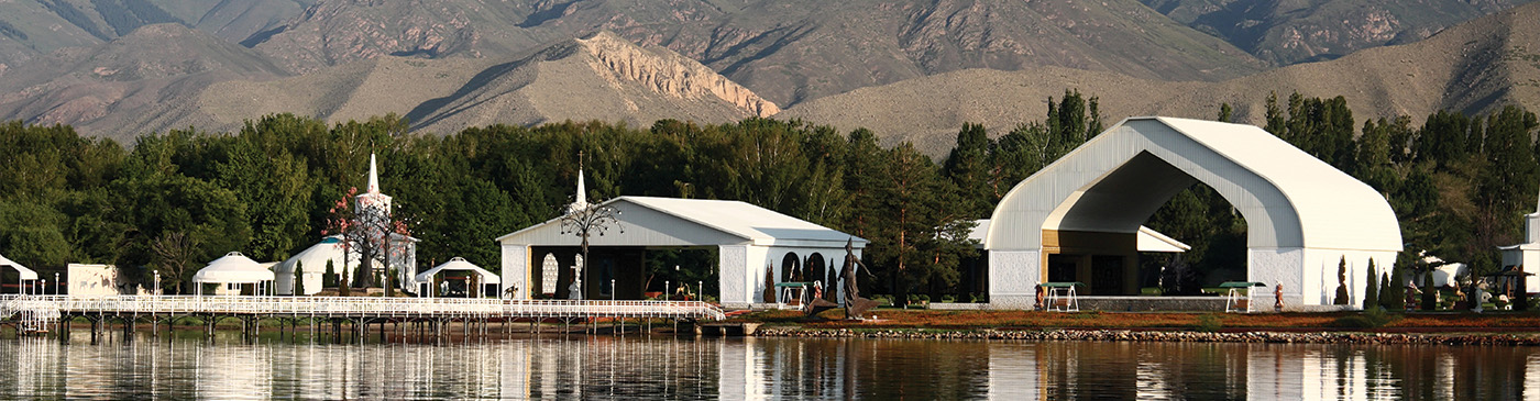 Architectural complex on the bank of mountain lake.Kyrgyzstan. Lake Issyk-kul.