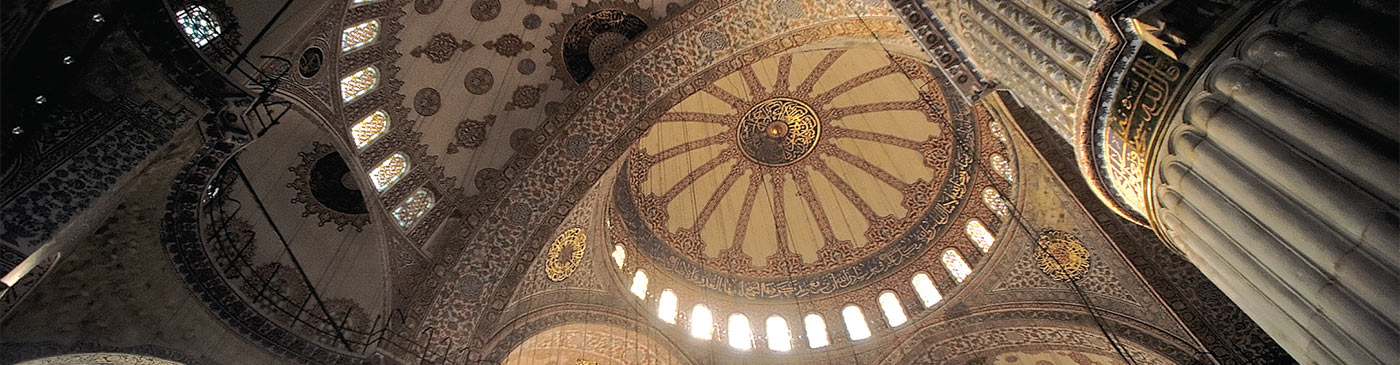 Interior view of the central dome and its supporting structure of pendentives, arches and semi-domes of the Sultan Ahmed Mosque (Blue Mosque), Istanbul, Turkey
