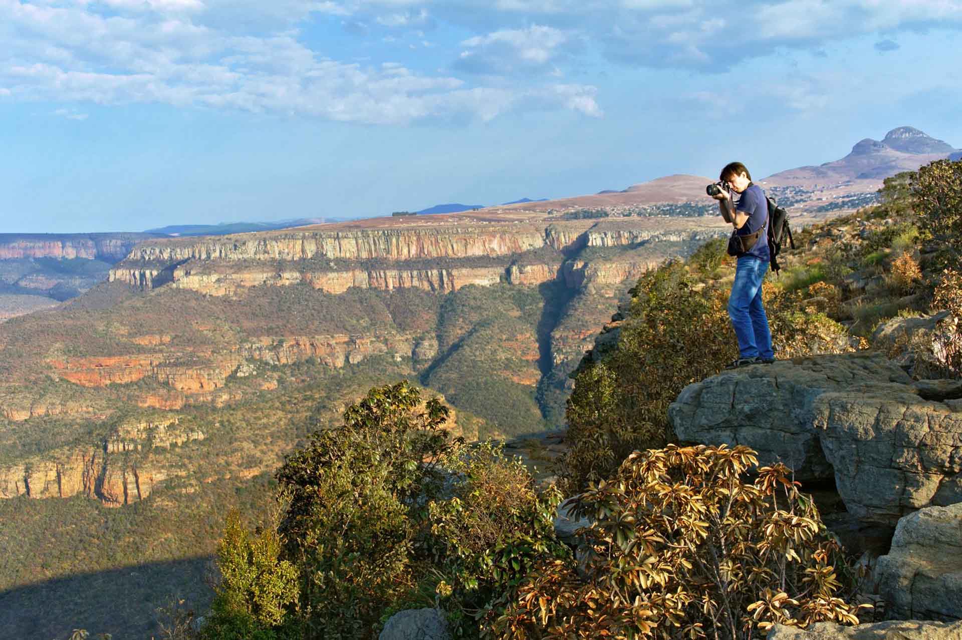 Photographer photograph the beauty of the Drakensberg Amphitheatre from the Witches Viewpoint in the Ukhahlamba Drakensberg Park