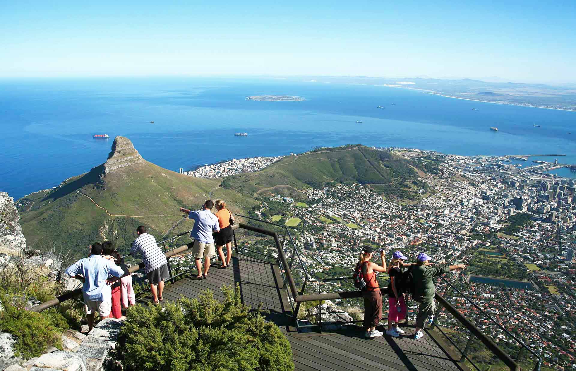Tourists enjoying breathtaking views of Cape Town from top of Table mountain