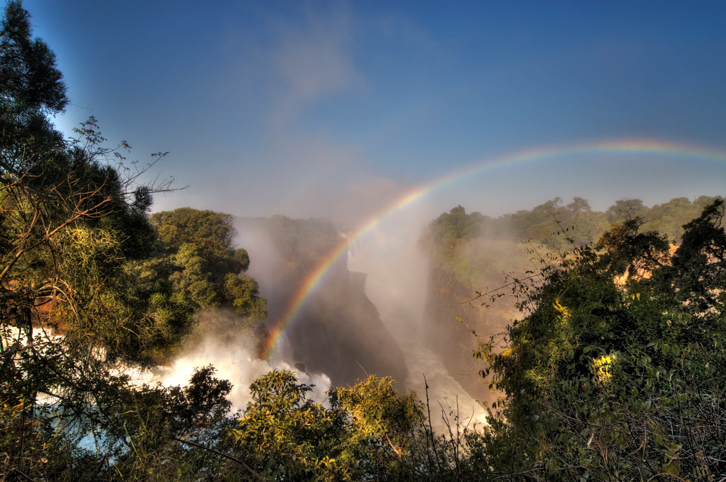 Rainbow over Victoria Falls on Zambezi River