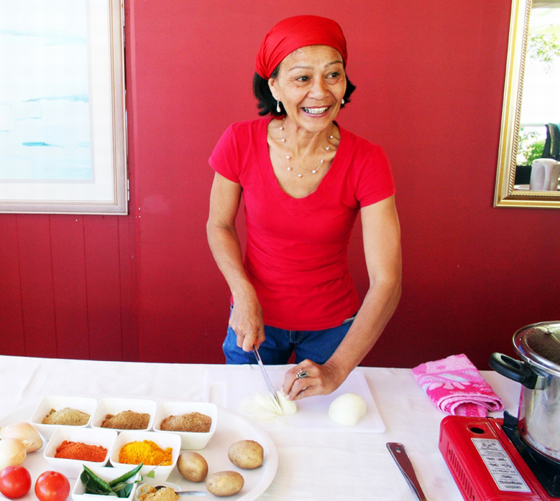 Woman enjoying cooking, Cape Malay Cultural Experience
