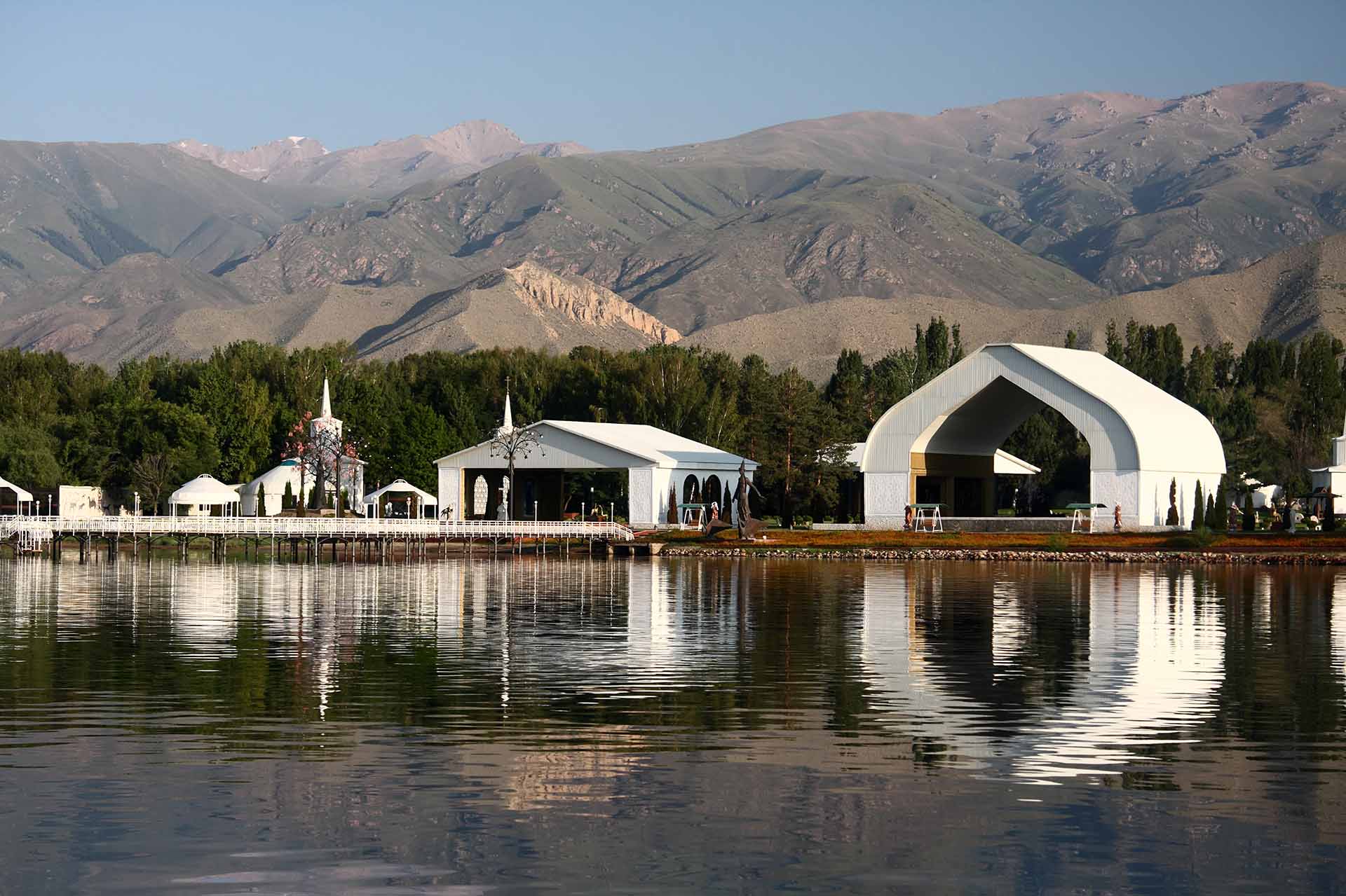 Architectural complex on the bank of mountain lake.Kyrgyzstan. Lake Issyk-kul