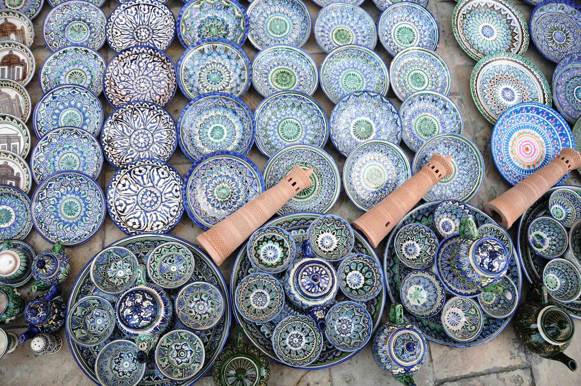Decorative ceramic plates with traditional uzbekistan ornament on street market of Uzbekistan