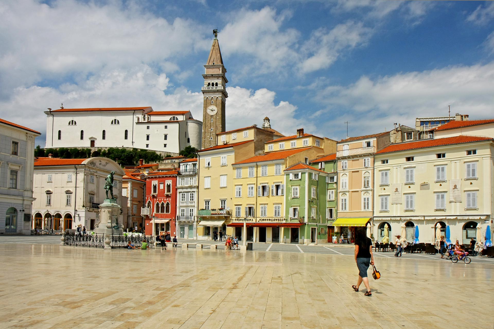 Tartini Square and Statue of Giuseppe Tartini overlooked by the venetian belfry of Saint George cathedral, Piran, Slovenia
