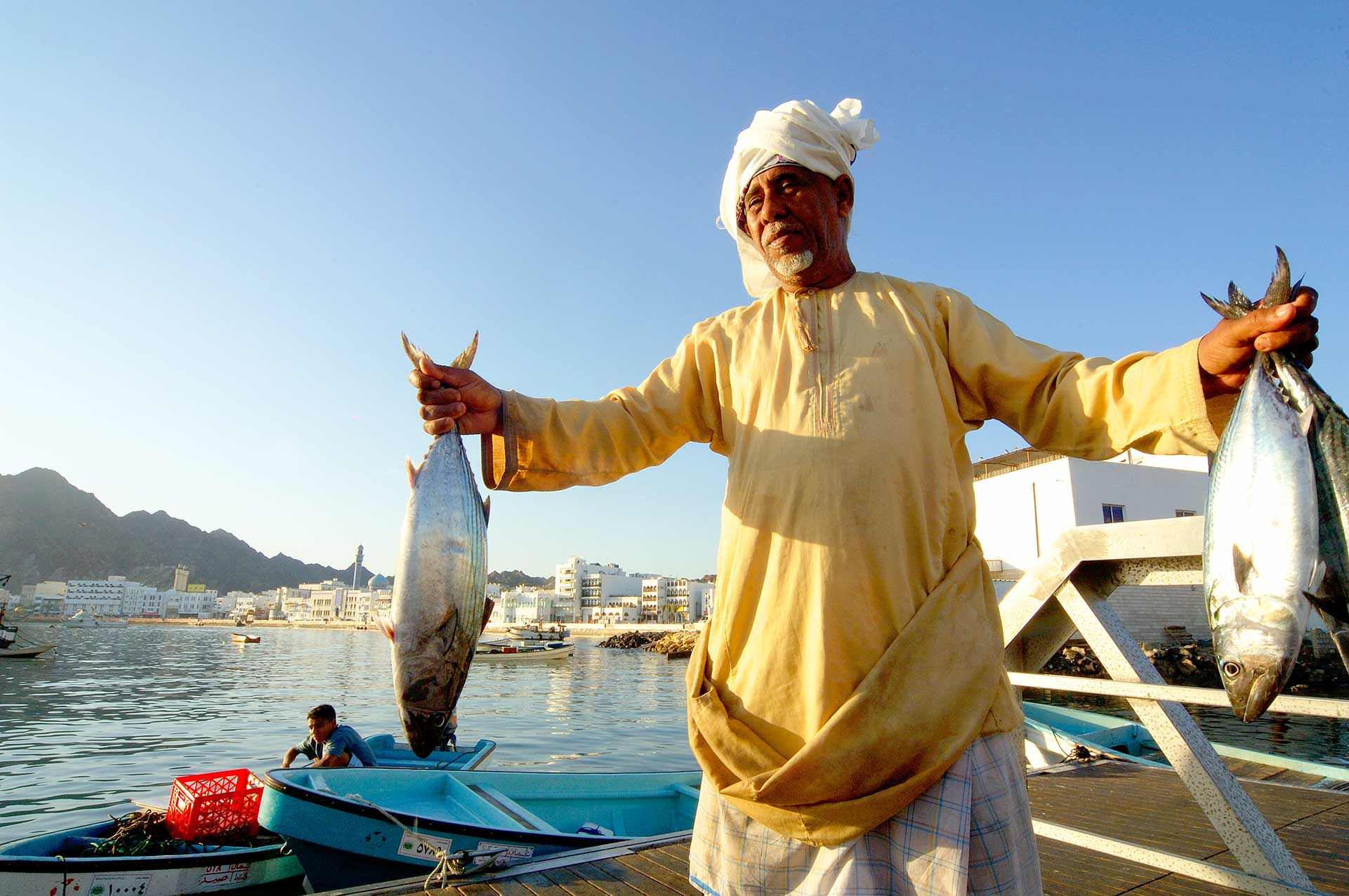 Vendor selling tuna at the fish souk in Muttrah