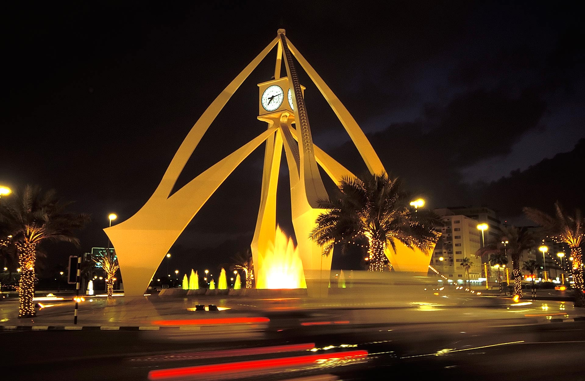 Clock tower on the Corniche Roundabout at night, Dubai, United Arab Emirates