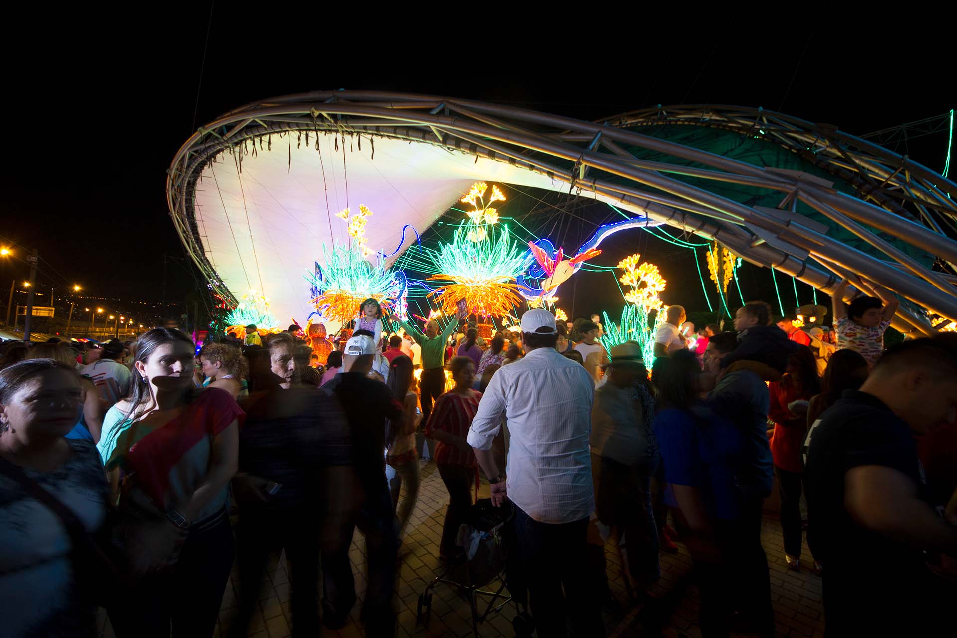 People admiring the Christmas lights display by the Medellin River at night, Medellín, Antioquia, Colombia