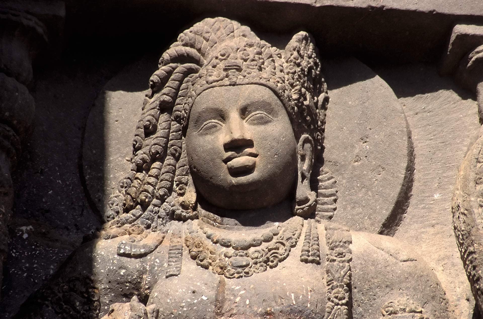 Bodhisattva sculpture by cave entrance, Ajanta Caves, Maharashtra, India