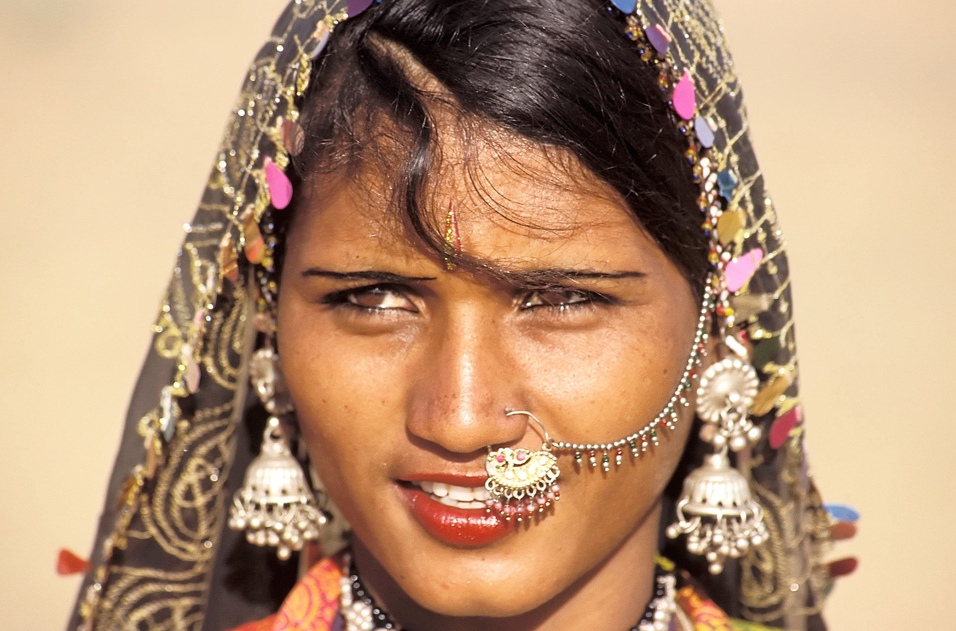 Woman wearing traditional Rajasthani jewellery and dress, Pushkar Camel Fair, Rajasthan, India