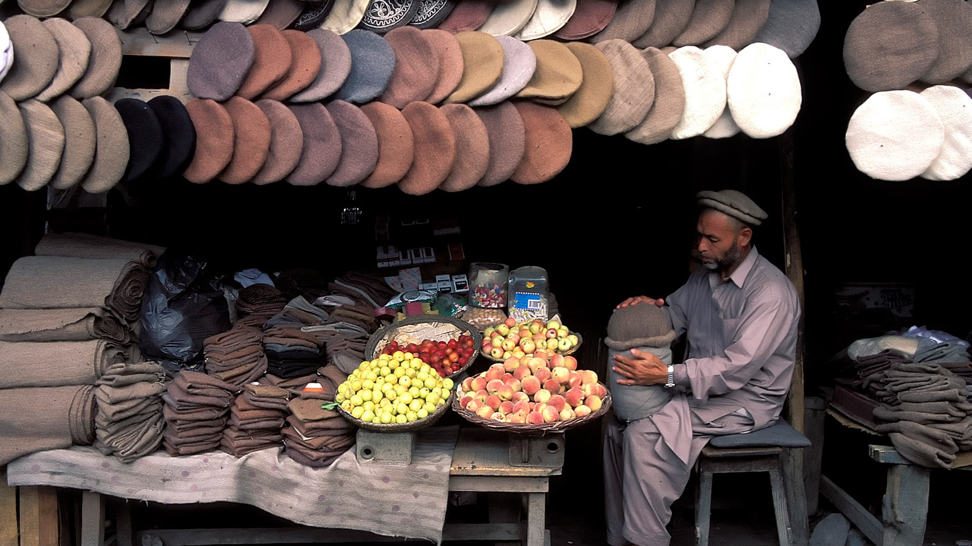 Chitrali Hat (Pakol) and fruit vendor, Gilgit, Northern Areas, Pakistan