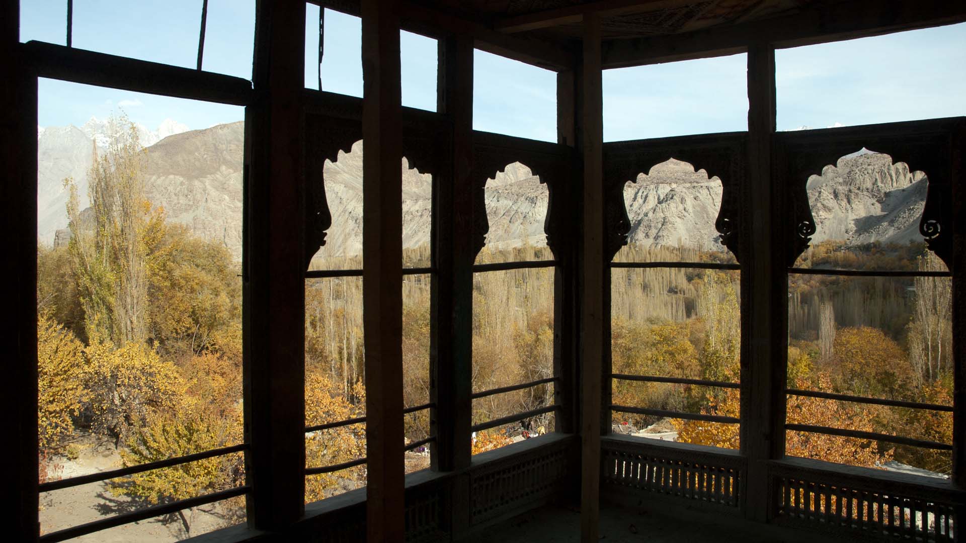 Interior view of a third story room, looking towards the timber loggia of the courtyard-facing guest room through open window of Khaplu Fort, Baltistan, Northern Areas, Pakistan