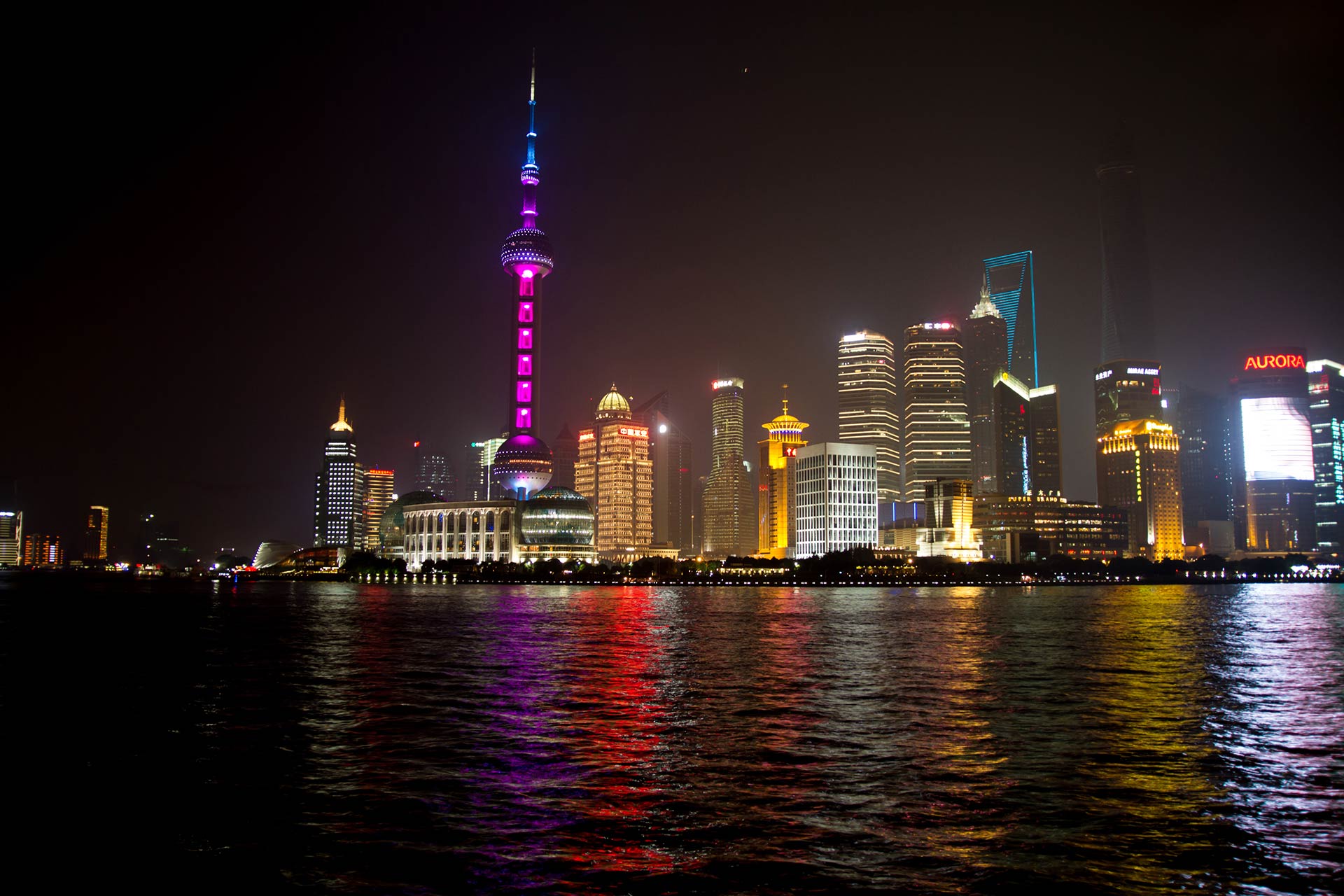Huangpu River and skyline with skyscrapers in Pudong at night, Shanghai, China