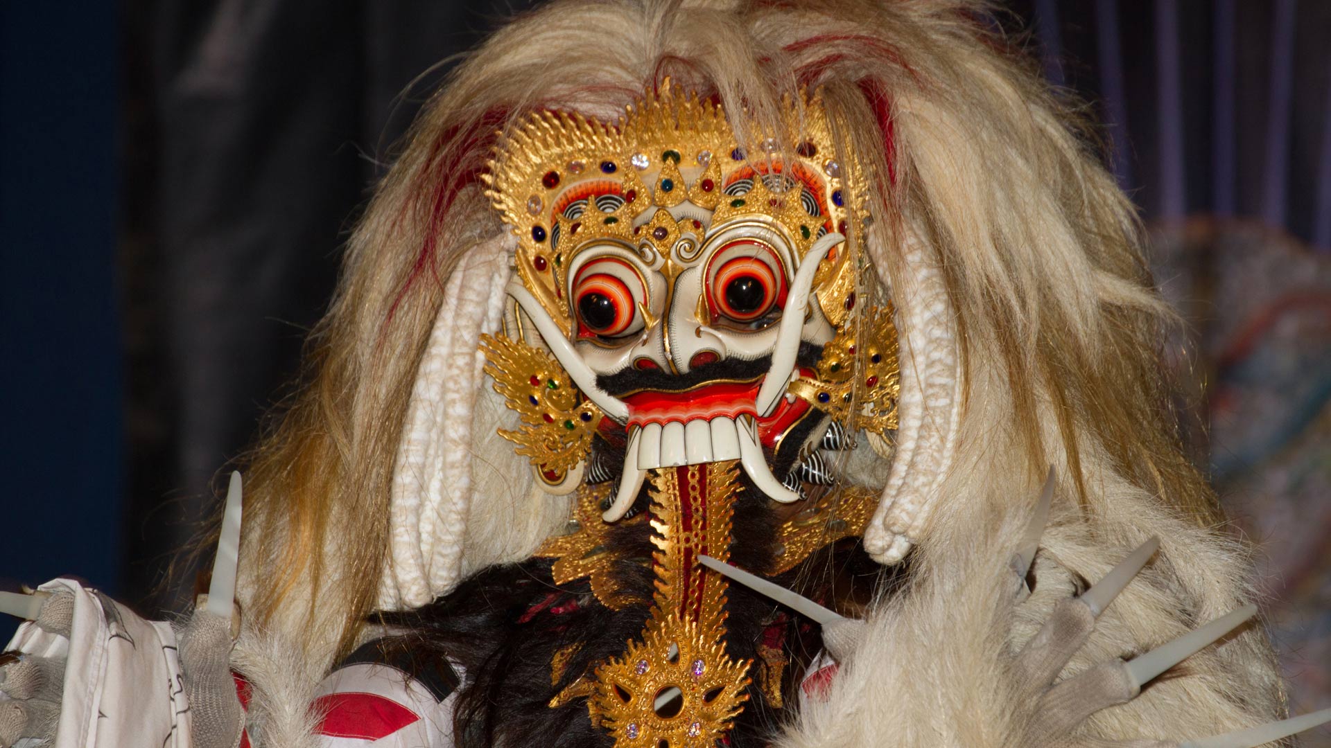 Rangda, a mythological creature in a Barong dance performance by the Raja Peni troupe in the evening, Ubud, Bali, Indonesia