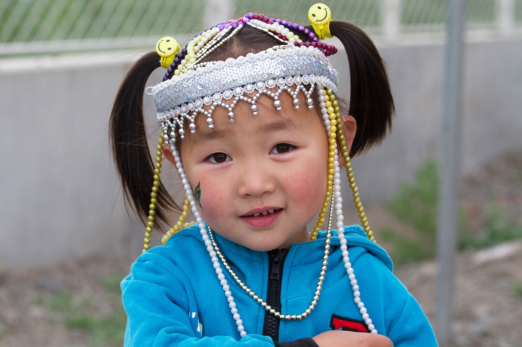 Girl at the Naadam Mongolian National Festival celebration by the National Sports Stadium, Ulaanbaatar (Ulan Bator), Mongolia