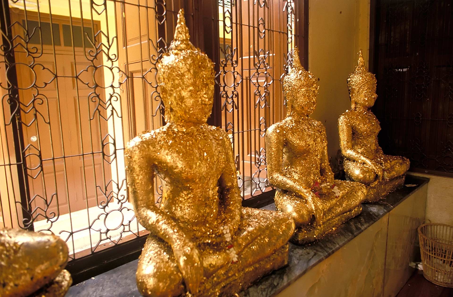 Buddha statues at a small shrine, Bangkok, Thailand